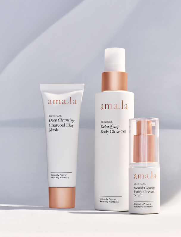 Three Amala products. Deep cleansing charcoal mask, Detoxifying body glow oil, Blemish clearing purify and prevent serum