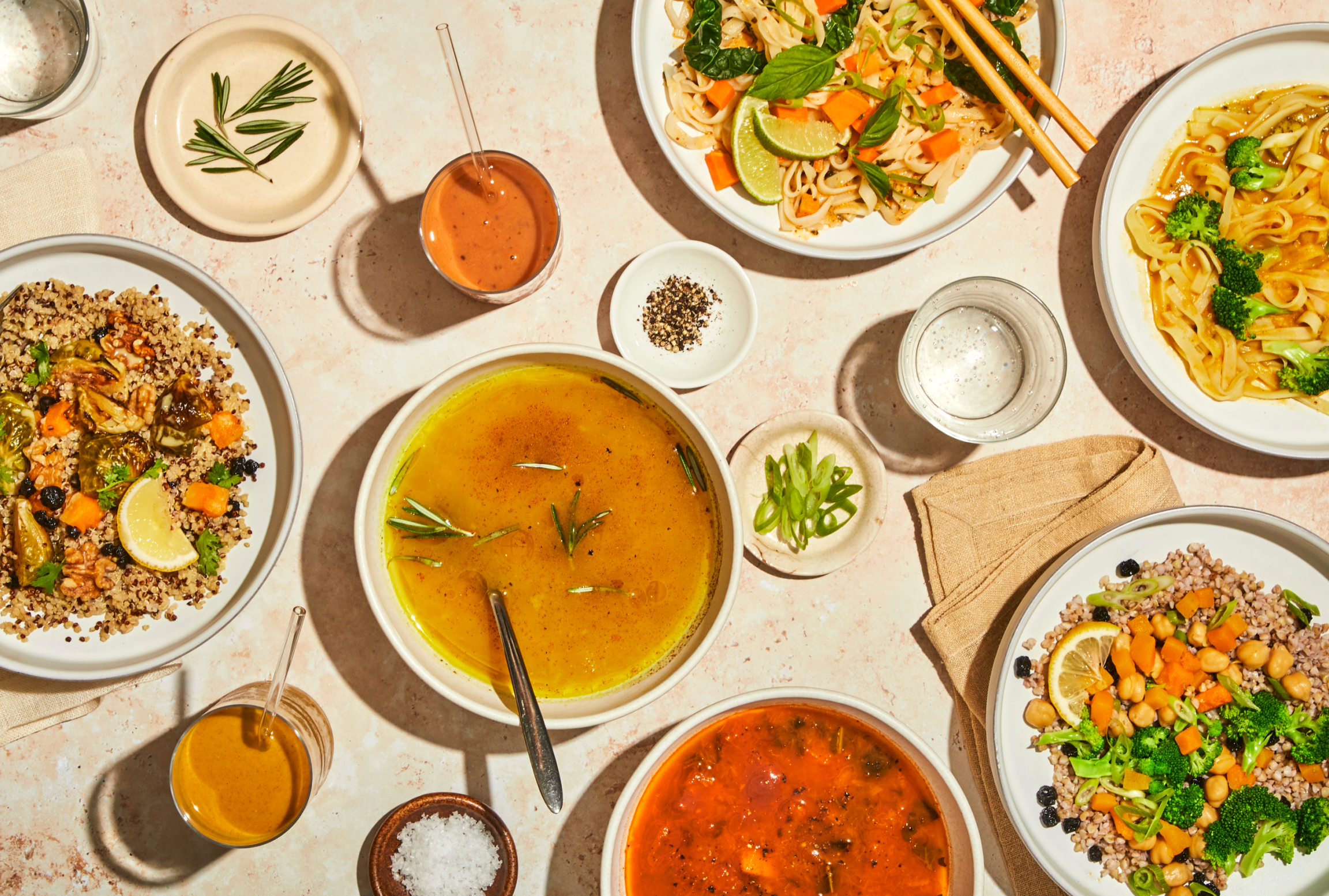 an abundant table scape of healthy plant-based prepared foods from Splendid Spoon