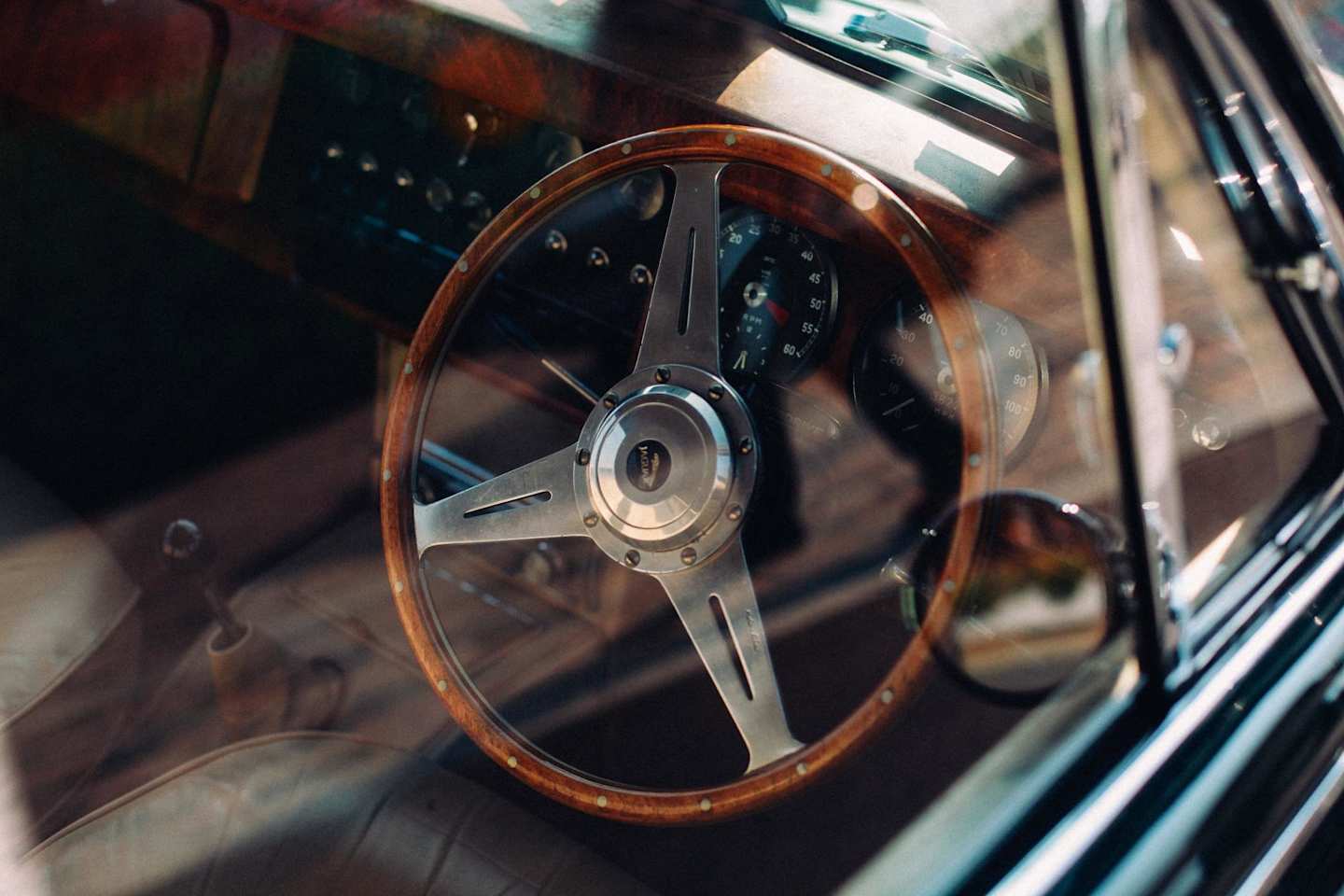 Brown steering wheel in old retro car dashboard