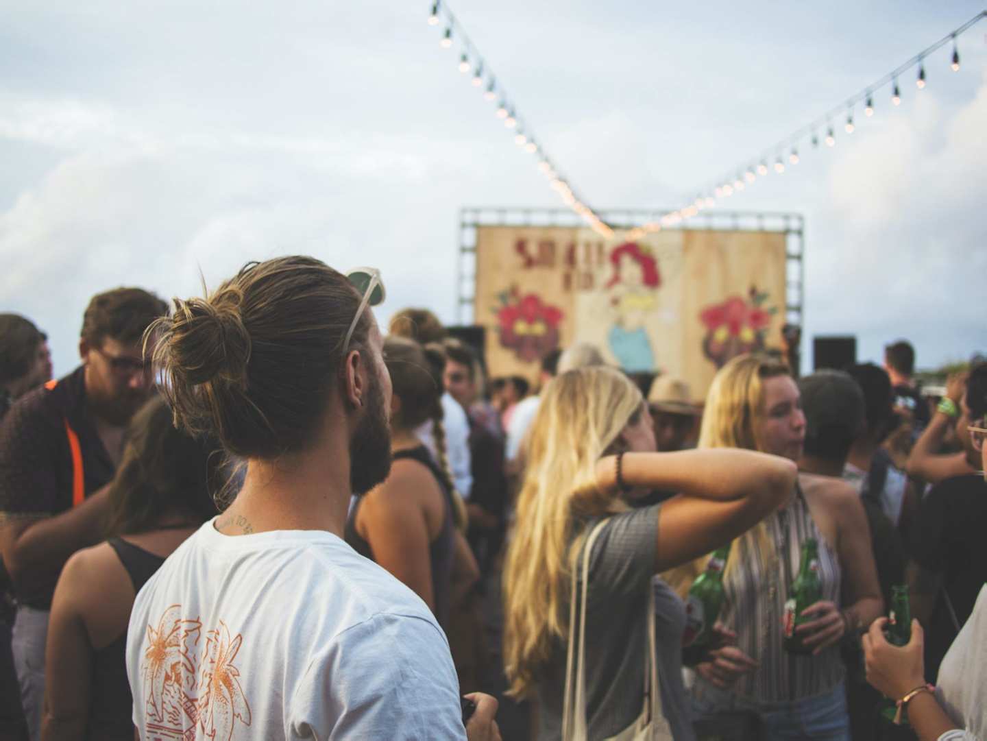 Man in a crowd at a music festival