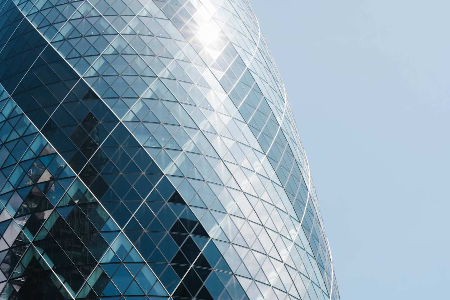 Close up of the Gherkin building reflecting the sun, London