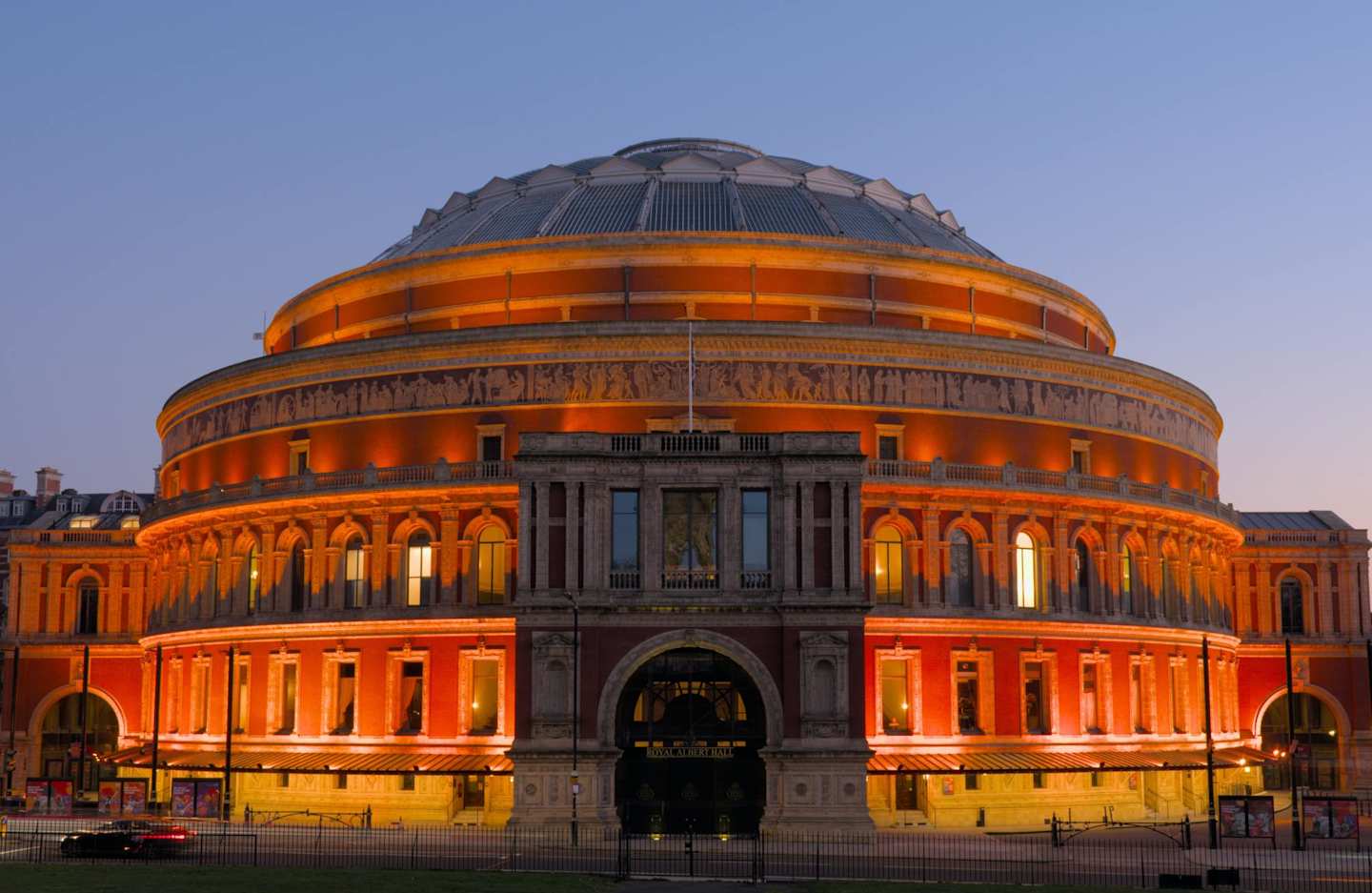 Royal Albert Hall lit up at sunset, London, UK