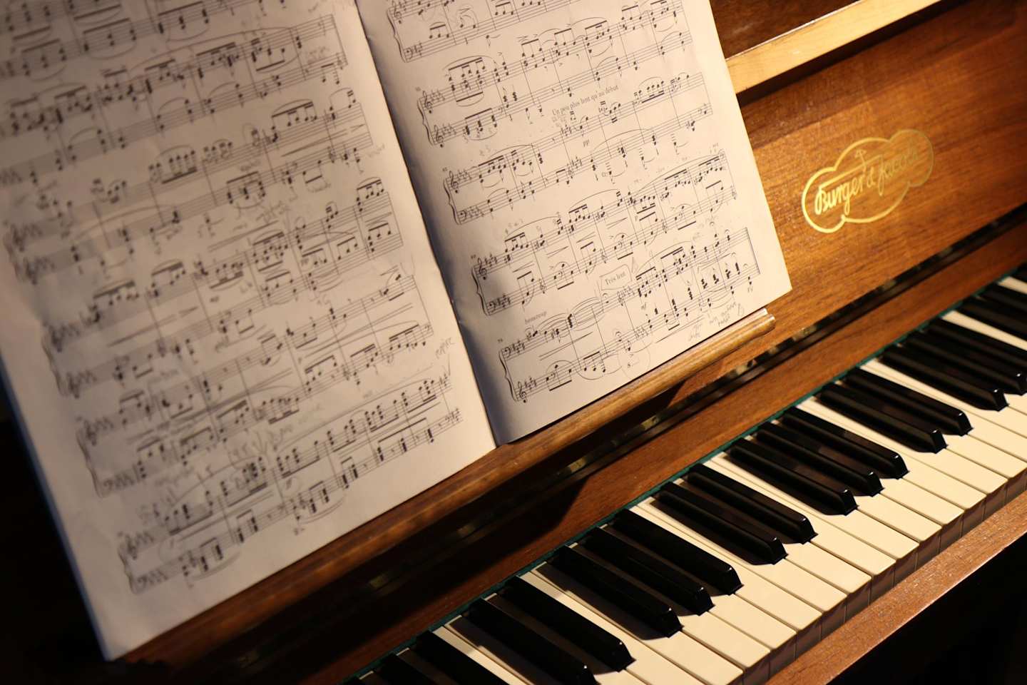 Sheet music on a brown piano