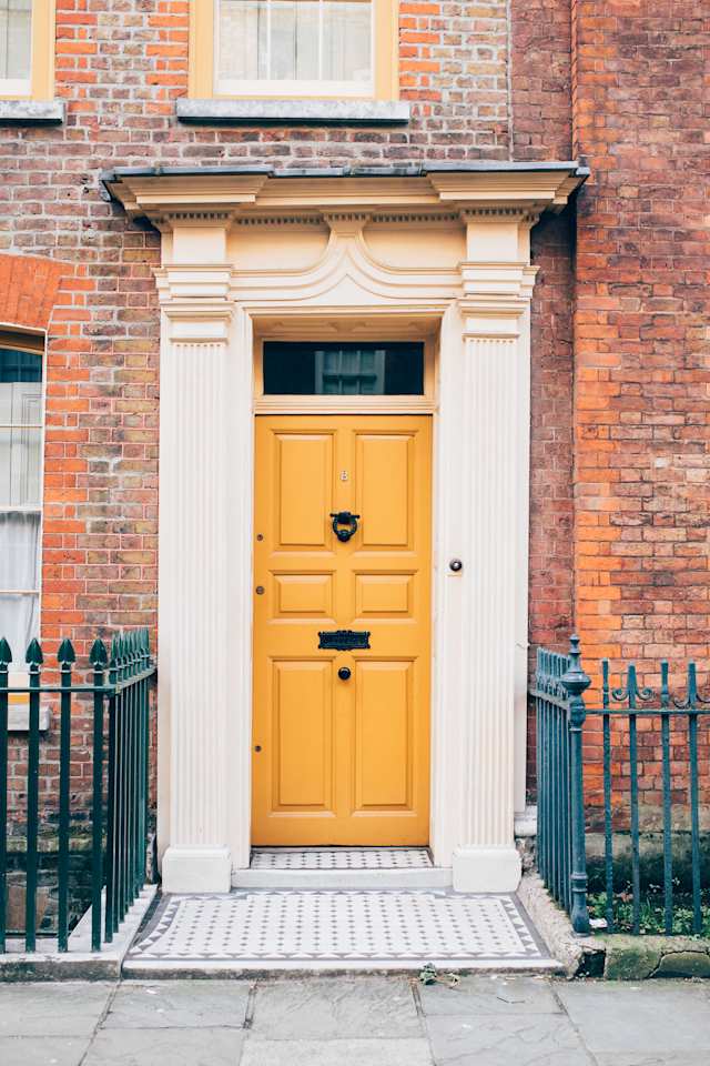 'Plum' - Period door in stylish colour against red brickwork