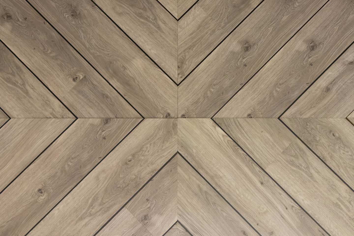 A close up of wooden panels on a floor with underfloor heating