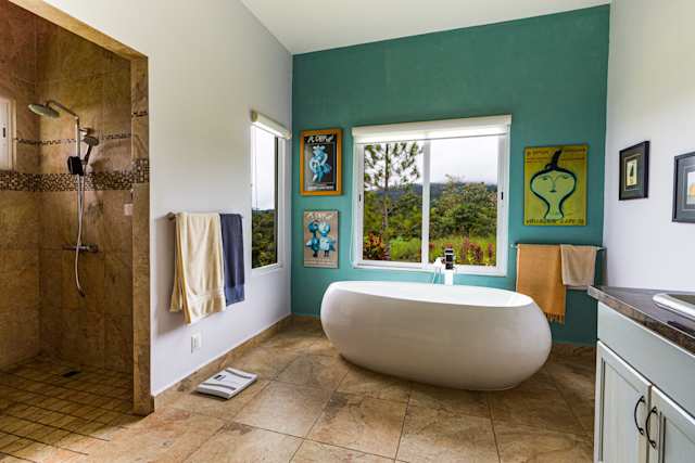 'Not Plum' - oddly-shaped bath, dated shower tiles and lack of consistency in the overall design