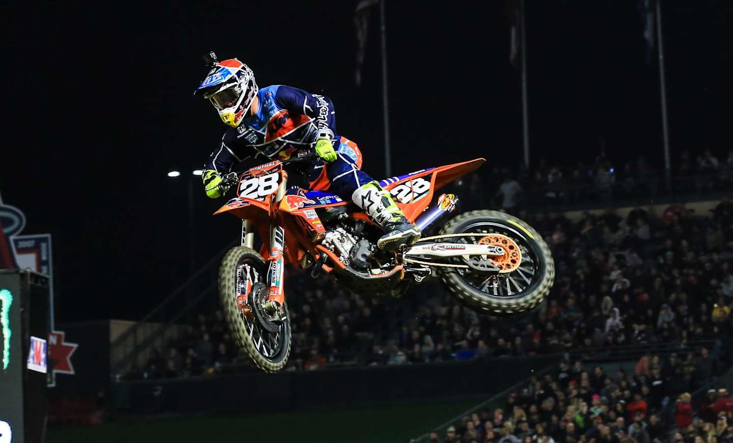 Supercross racer riding a motorbike at an event