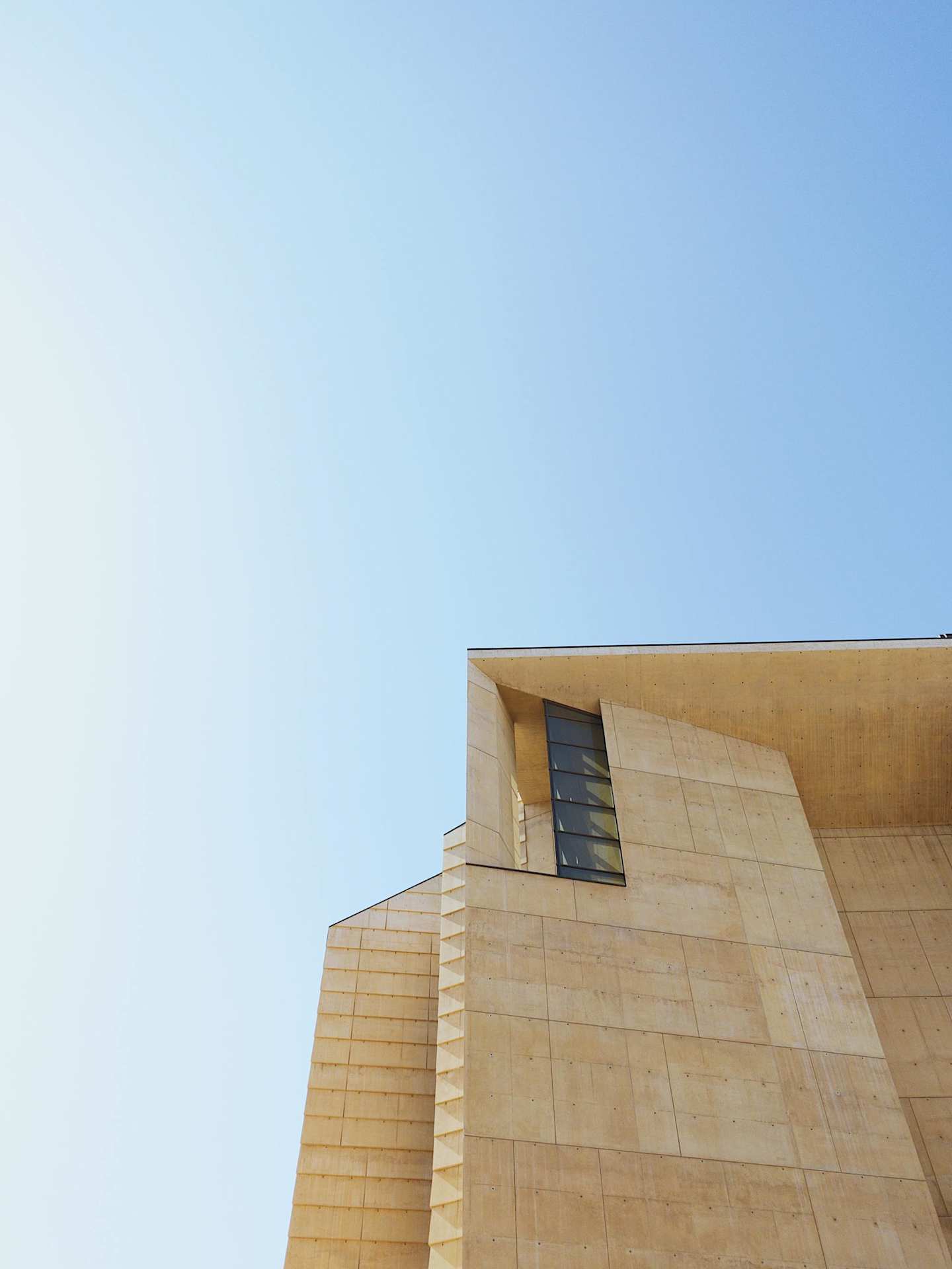 The corner of a Los Angeles building under blue sky