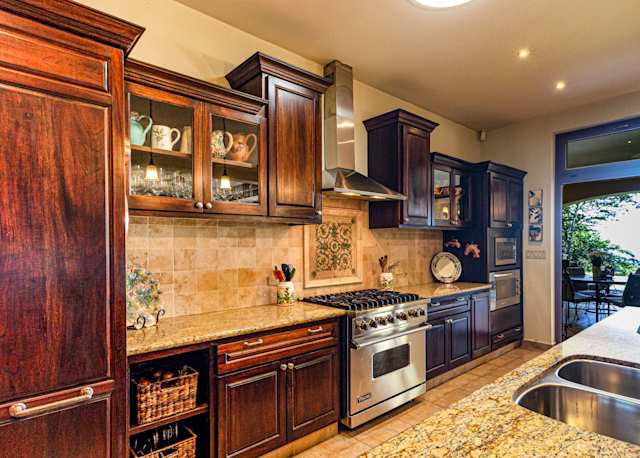'Not Plum' - very dated kitchen design and choice of wood