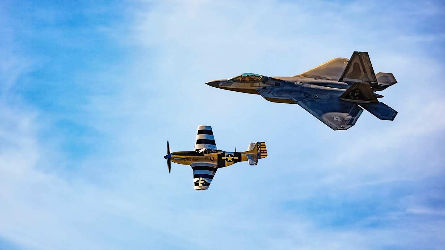 Two planes in the sky at an airshow