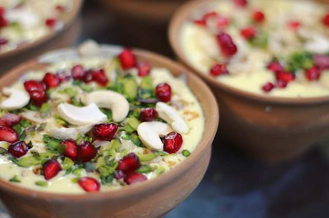 Hummus topped with Herbs and Pomegranate