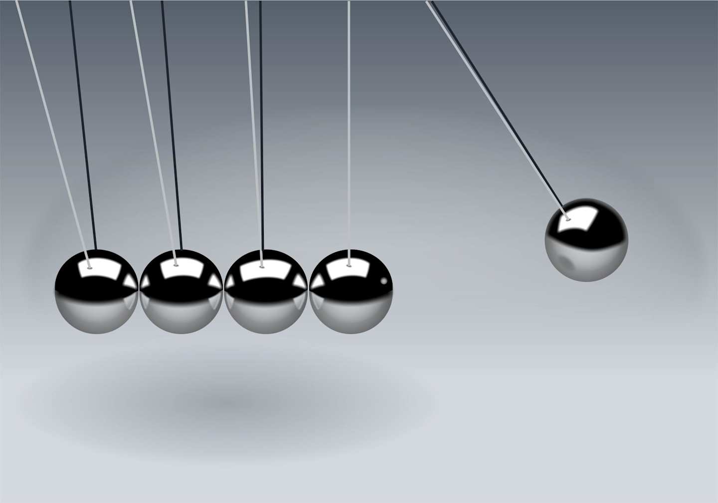 Small metal balls hanging from string in a scientific tool