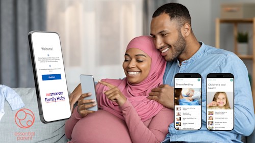 Smiling couple on a couch looking at a smartphone, with pictures of smartphones showing a parenting app about breastfeeding and children's oral health.