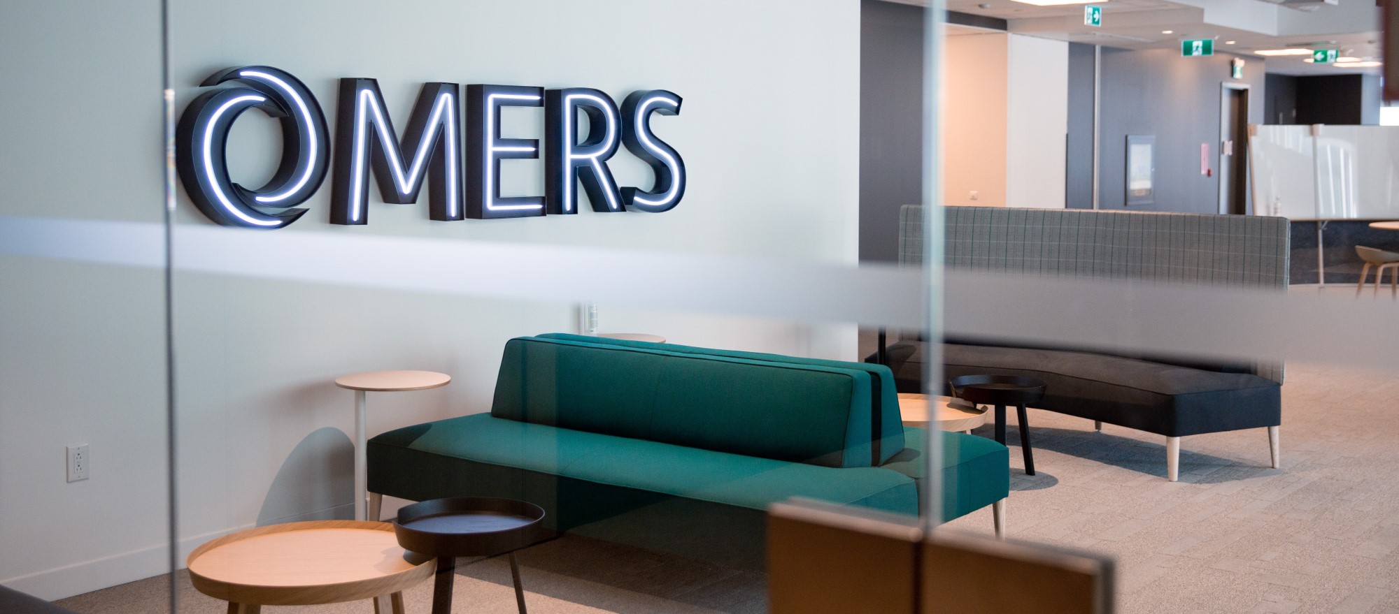 The inside of an office building with OMERS on the wall