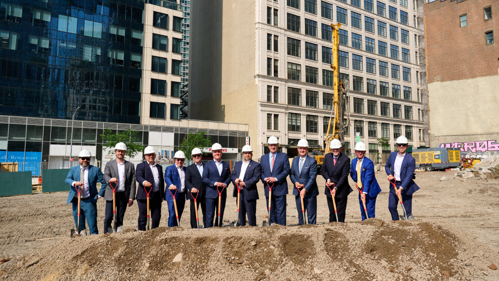 Oxford Properties breaks ground at 70 Hudson Yards A group of men in suits and white hard hats holding shovels where Oxford Properties broke ground at 70 Hudson Yards.