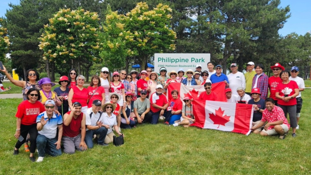 Philippine Park A group of people in Canada t-shirts posing in front of Philippine Park