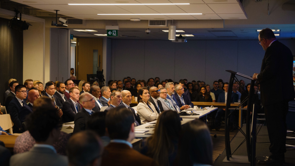 Chief Economist Forum - 2026 Robert Lavigne speaking at a podium to a room full of people.
