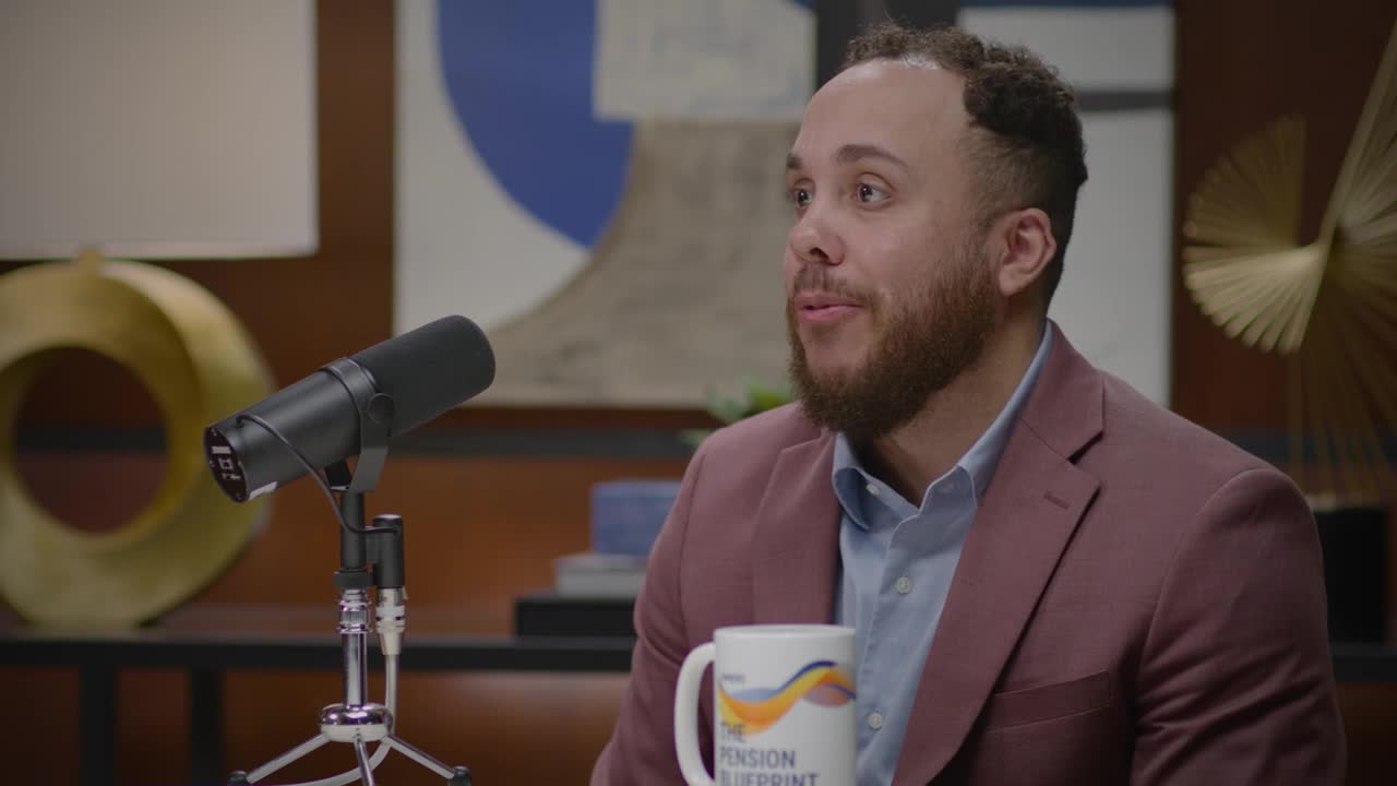 A man sitting in front of a microphone