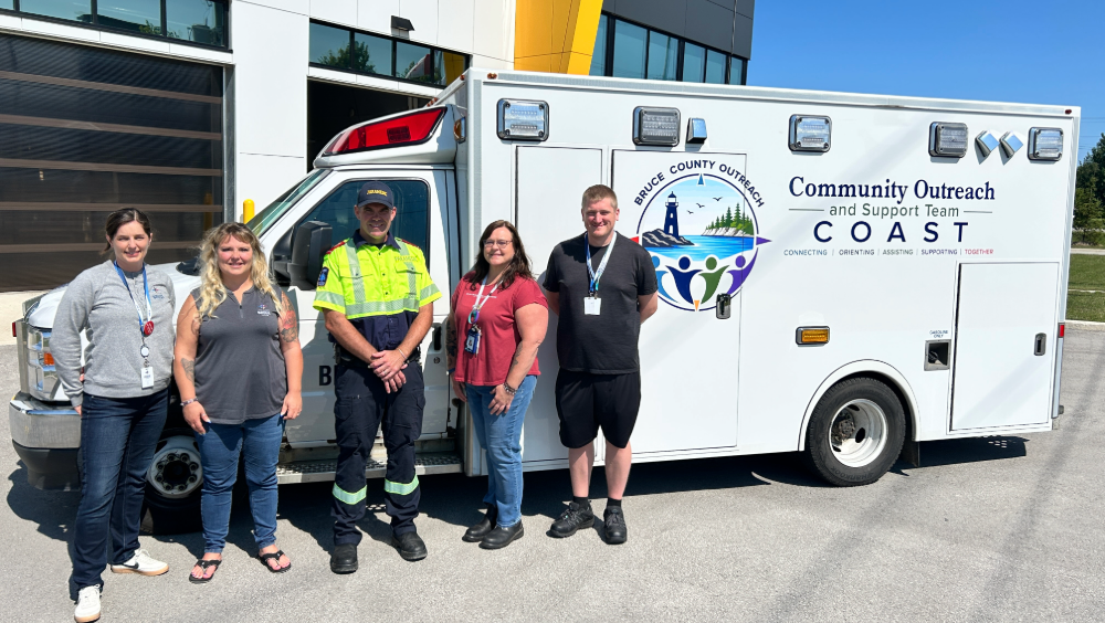 Bruce County COAST program A group of people standing in front of a Bruce County COAST ambulance