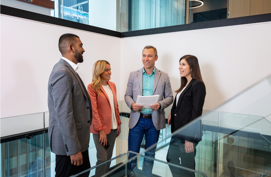 A group of people standing and talking