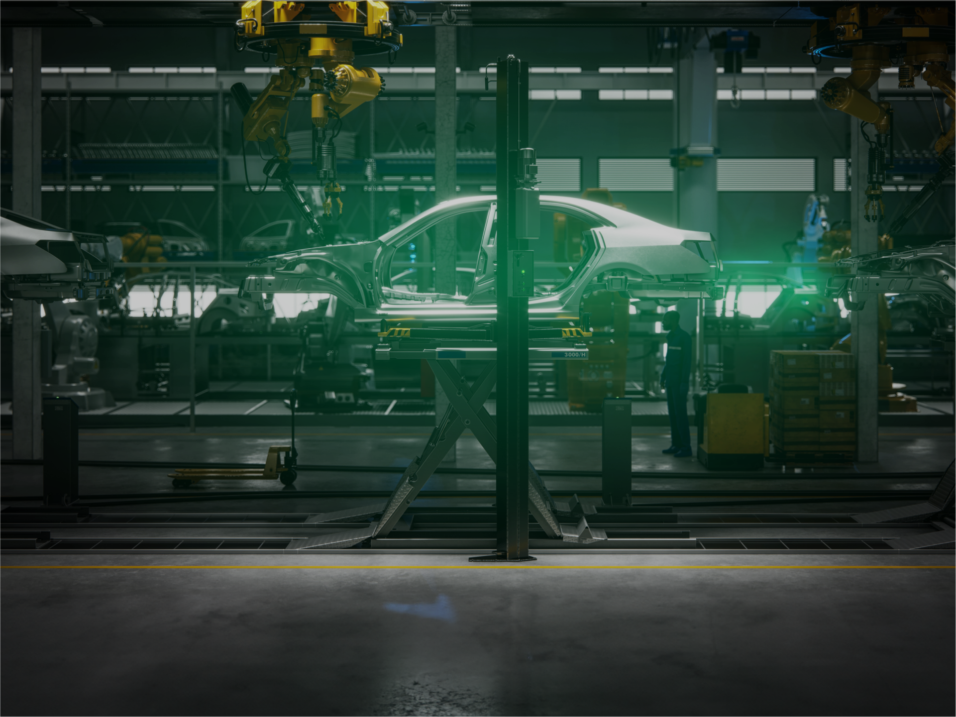 Side view of a car body on a production line in a car factory surrounded by various assembly machines