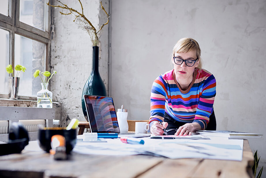 woman working on art