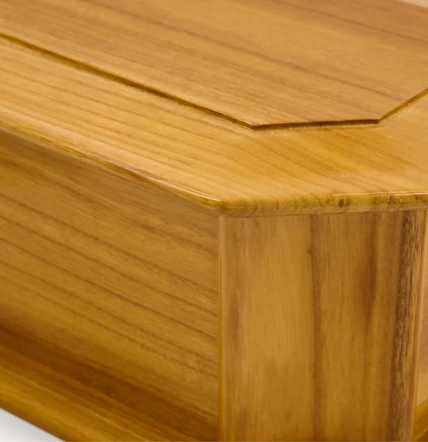 Close up of wooden urn showing light coloured wood