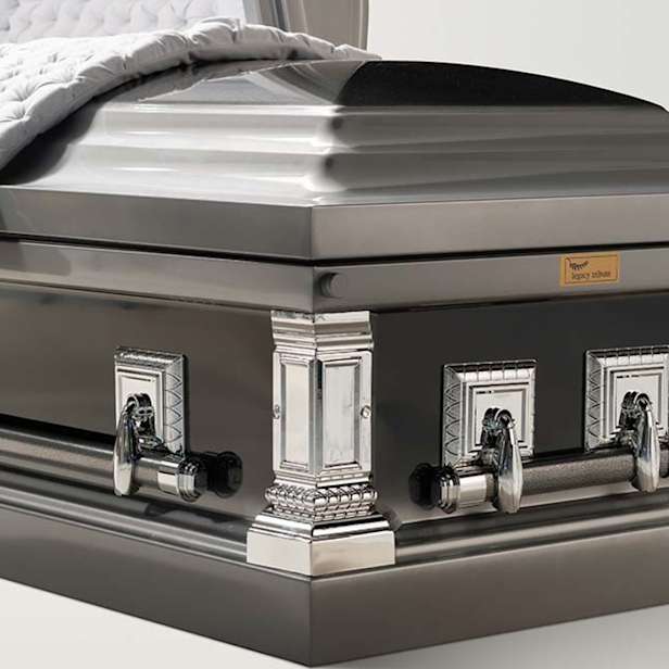 Close up of black and silver twilight coffin with metal handles and corners