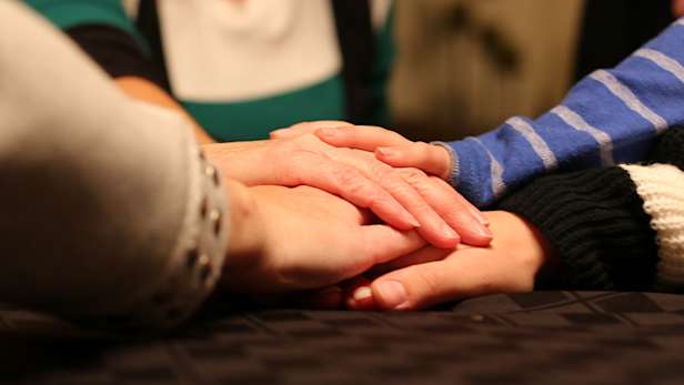 A group of people holding hands