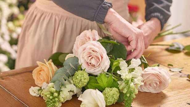 Florist preparing flowers