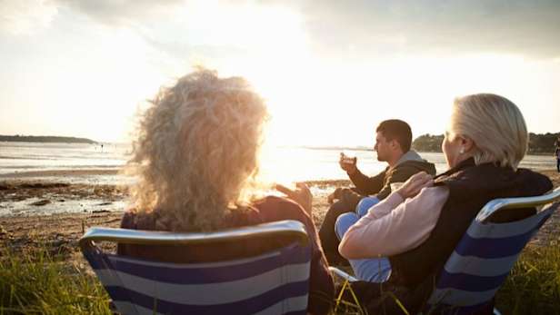 CWC family members relaxing by beach