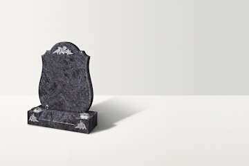 A dark blue-grey granite heandstone with an arc top. There are thistle ornaments on the top and two at the base, underneath two vases.