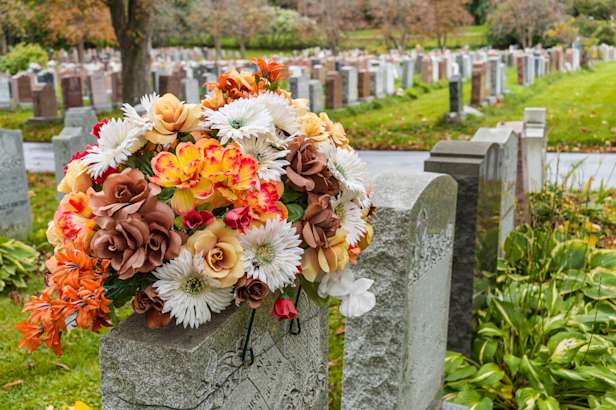 Autumnal flowers on a gravestone