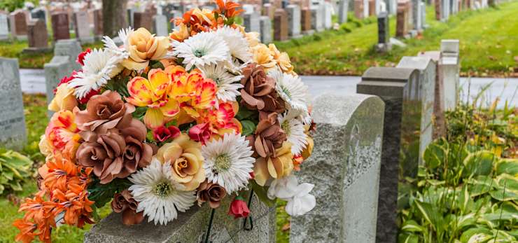 Autumnal flowers on a gravestone