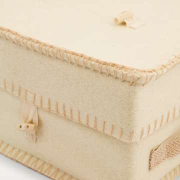 Close up of cream wool urn with stitch detail