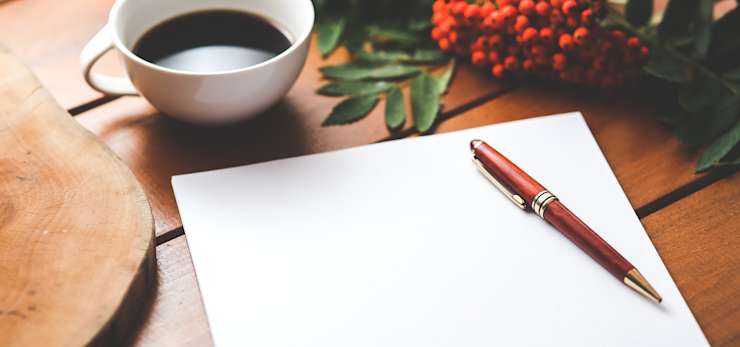 A blank pad of paper with a pen resting on top.
Photo by Kaboompics .com from Pexels
