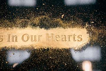 Image of gold engraving on a black granite headstone. Close up image. R4A0745