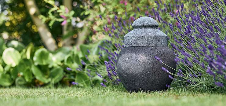 Garden urn on grass.
