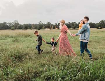 Family walking across field