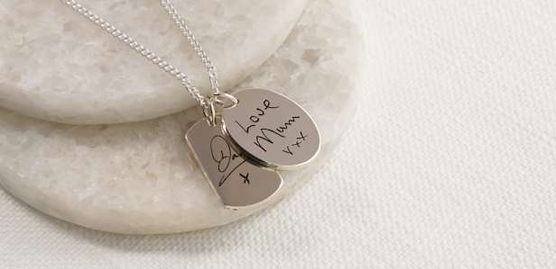 Silver pendant with handwriting inscription
