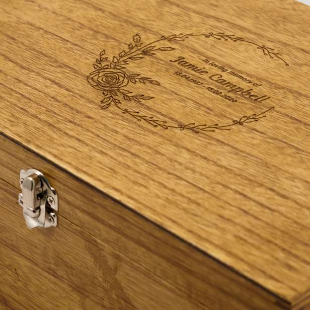 Close up of wooden box with engraved lid