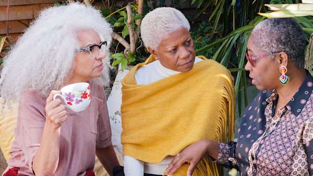Three ladies having a chat.