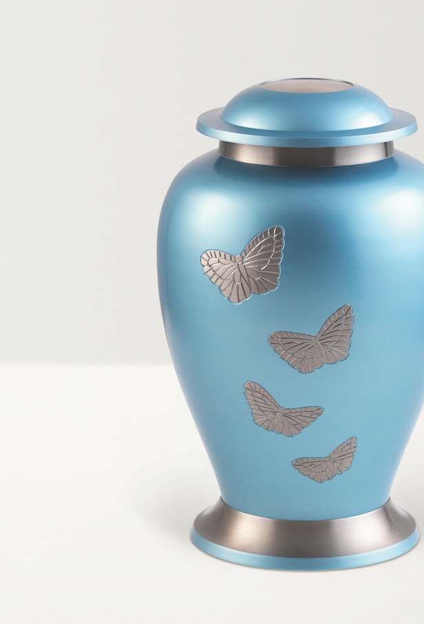 Detail shot of blue butterfly urn