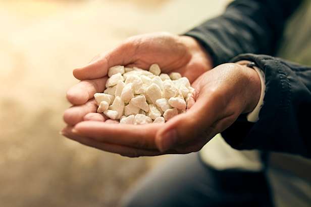 White chippings in hands