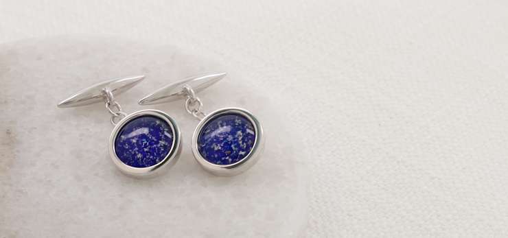 Silver cufflinks with blue glass centres