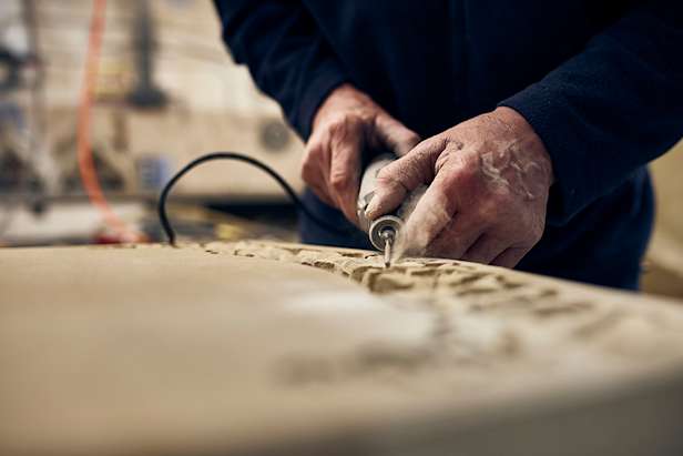 A man carving wood