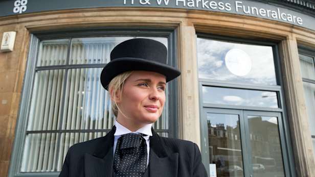Funeral Director Raegan Drew, stood outside HW Harkess Funeralcare