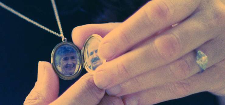 A locket necklace with pictures on