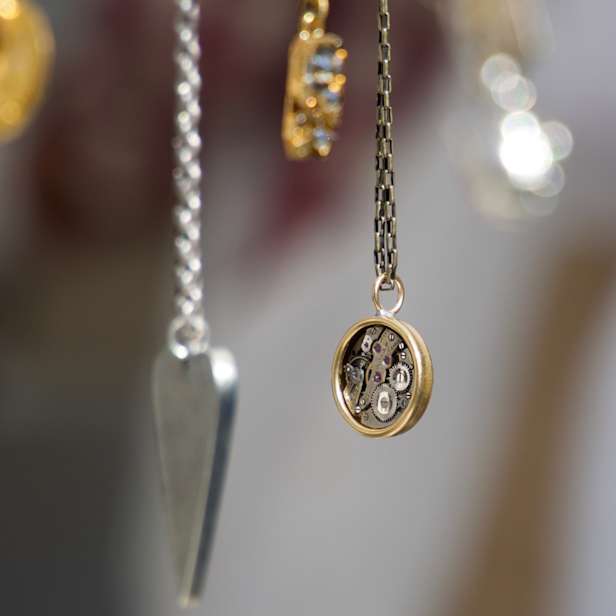 Three pendants hanging on chains