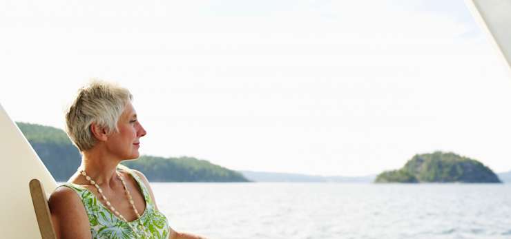 Woman looking out at sea on a boat